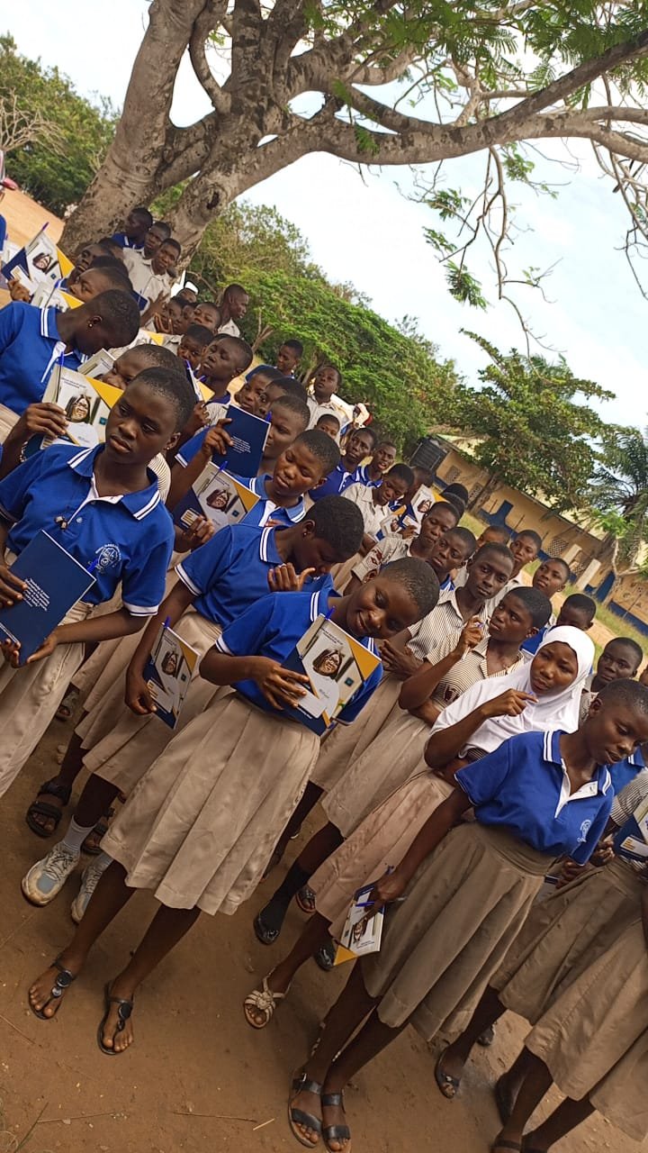 Students lining up with their new books